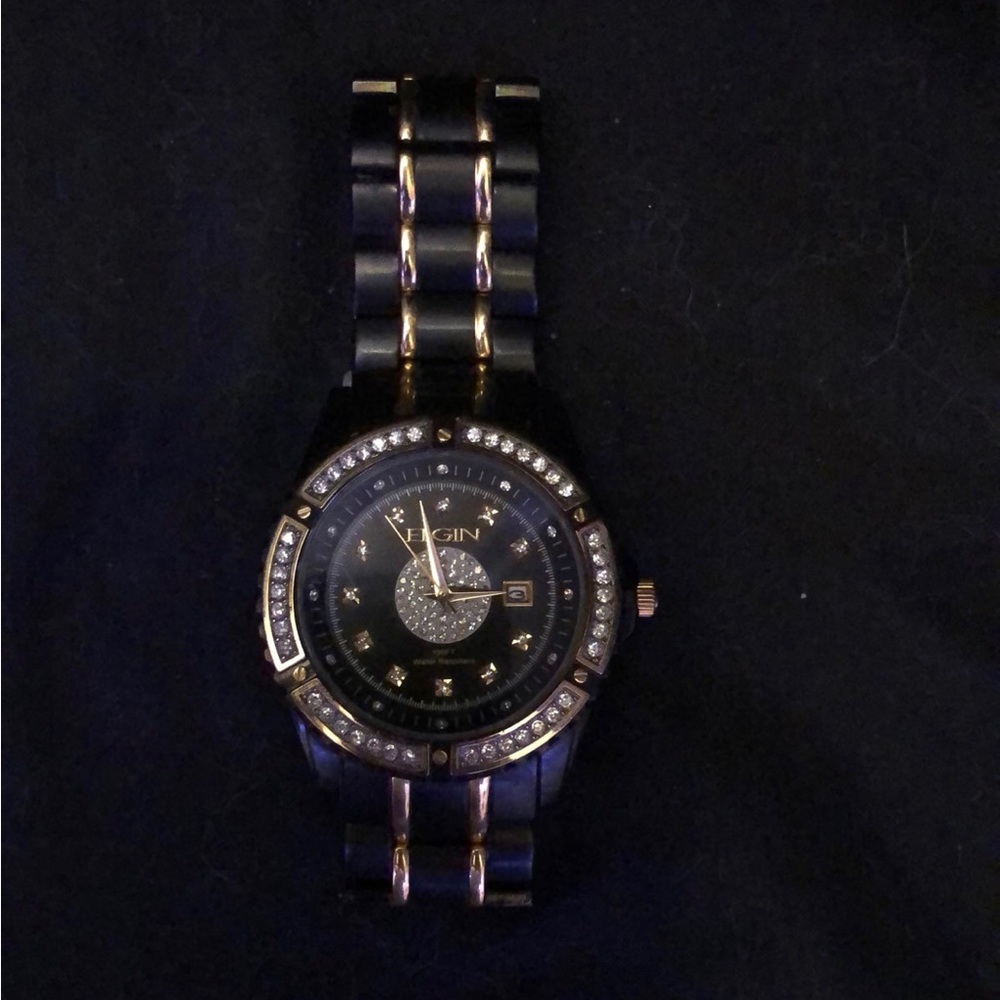 Elgin black and gold watch